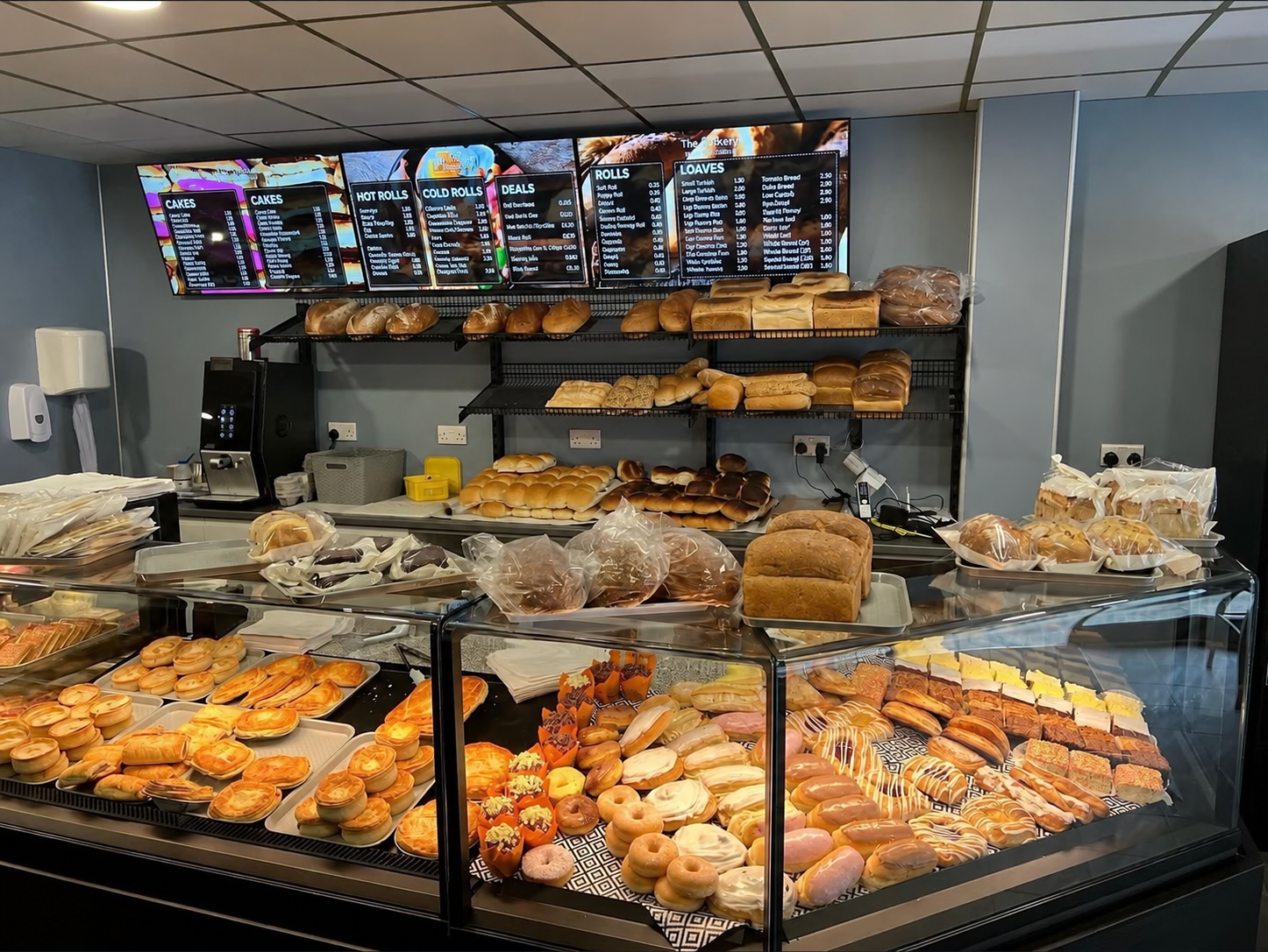 Inside The Bakery, with bread, savouries and cakes on display